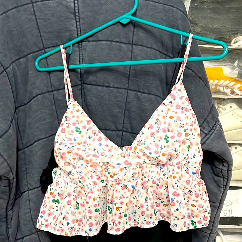 Medium floral blouse.